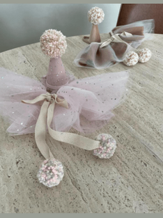 Pink cape and a birthday hat